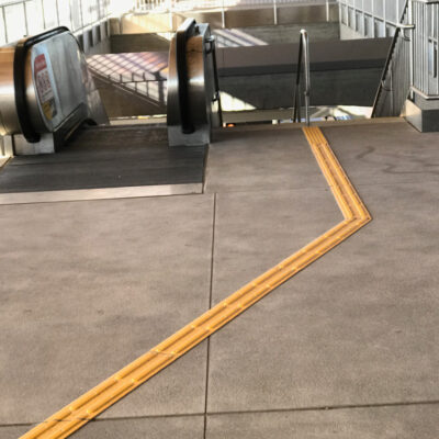 stair and escalator landing detectable warning surface